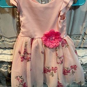 Pink and white dress with a bow